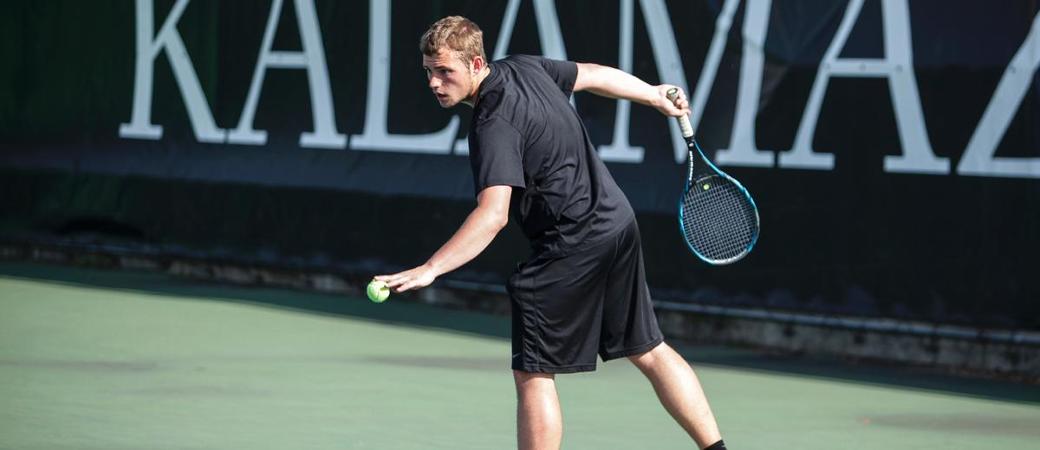 Eric De Witt playing tennis.