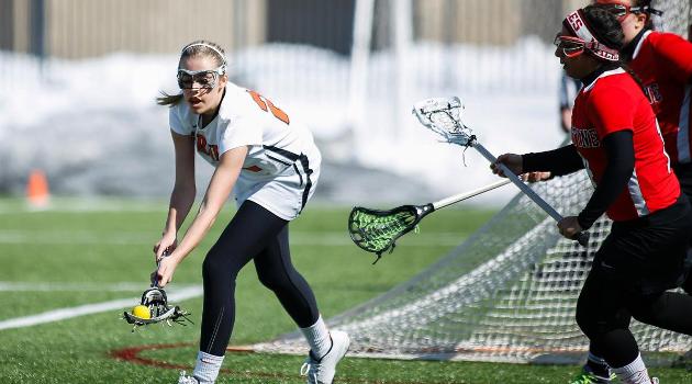 Alivia DuQuet playing lacrosse.