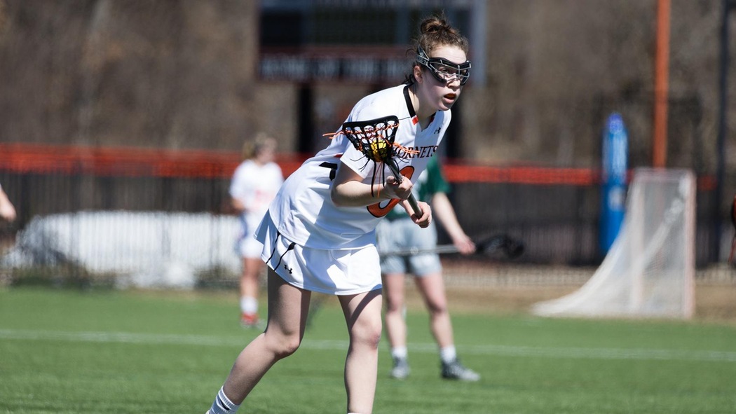 Lilly Baumann playing lacrosse. 