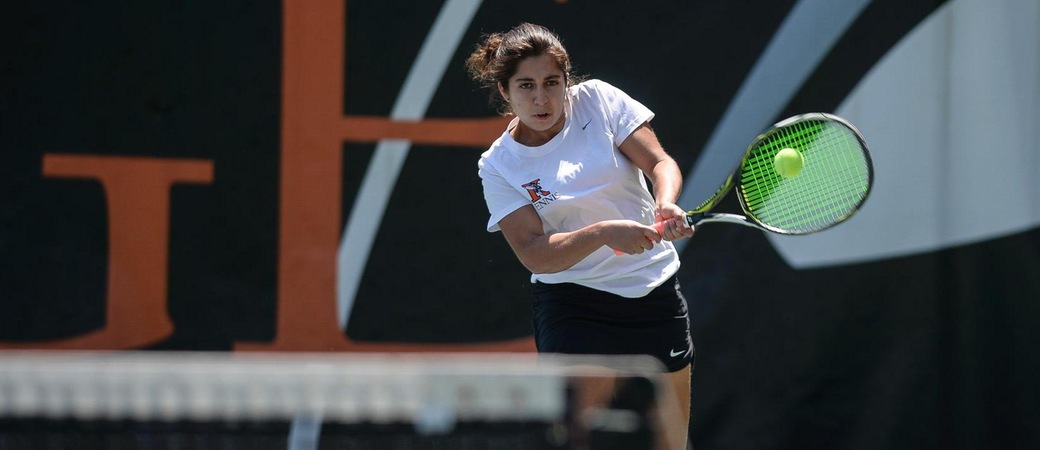 Maria Franco playing tennis.
