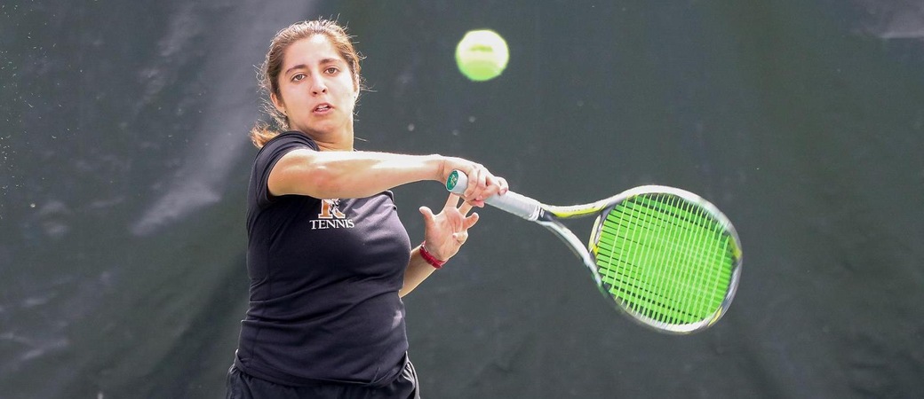 Maria Franco playing tennis.