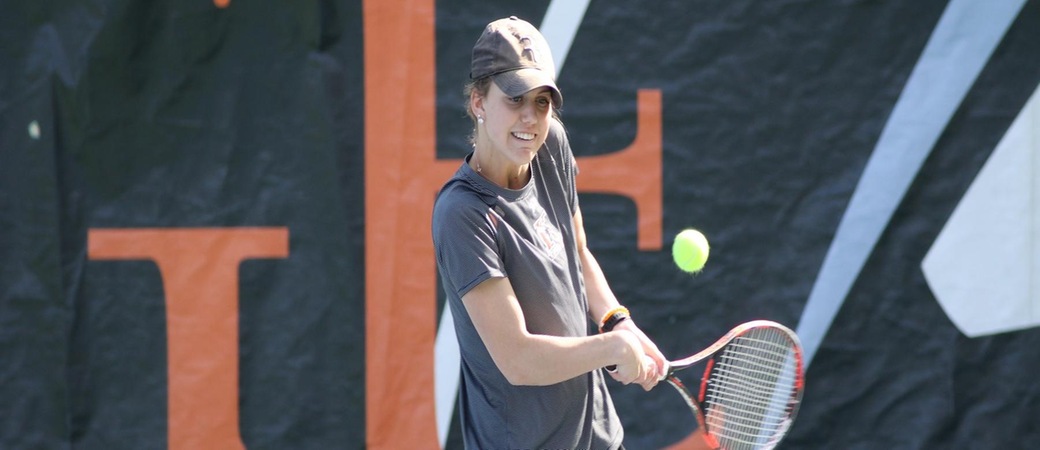 Laura Hanselman playing tennis.