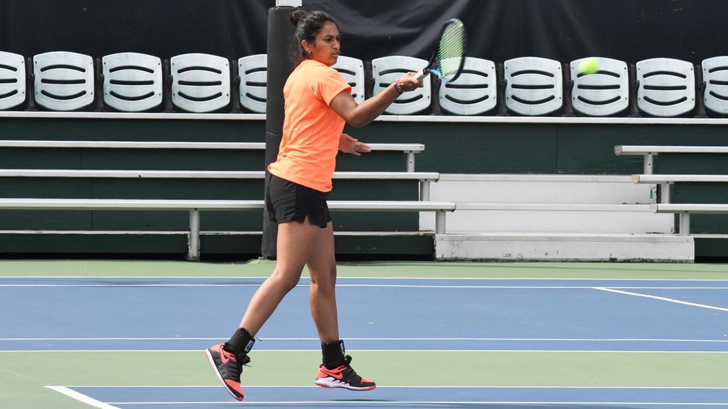 Sonal Bahl playing tennis.