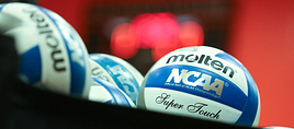 A photo of a basket of volleyballs.