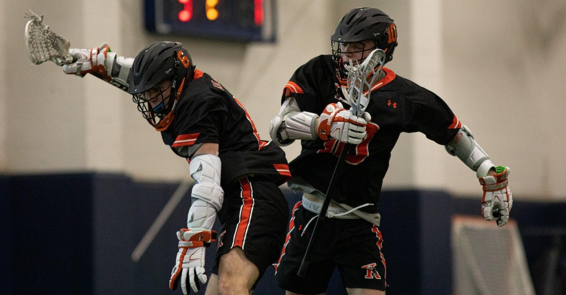 Dylan McGorisk and Brandon Wright playing lacrosse.