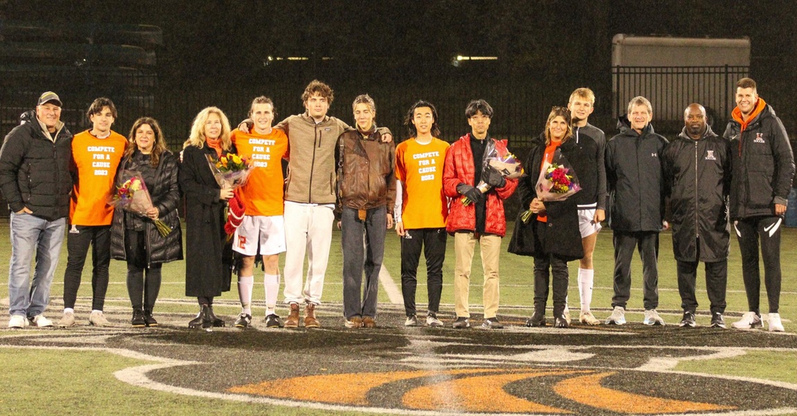 The Kalamazoo men's soccer seniors with their families and coaches.
