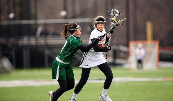 Alivia DuQuet playing lacrosse.