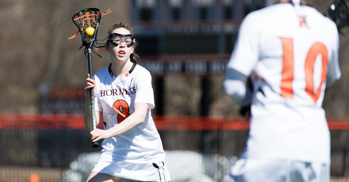 Lilly Baumann playing lacrosse 