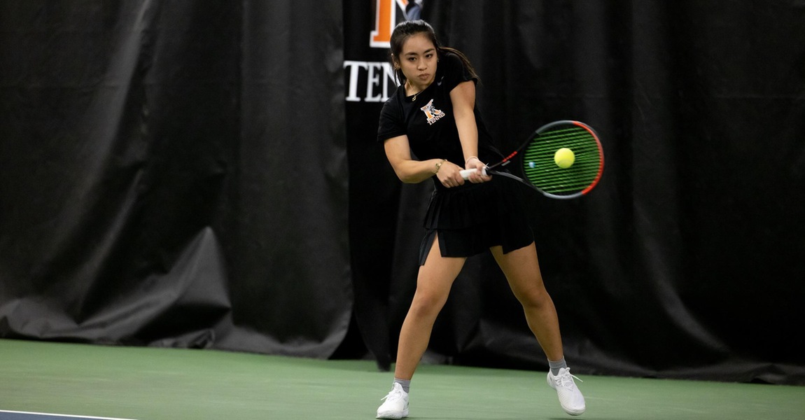 Sophie Zhuang playing tennis.