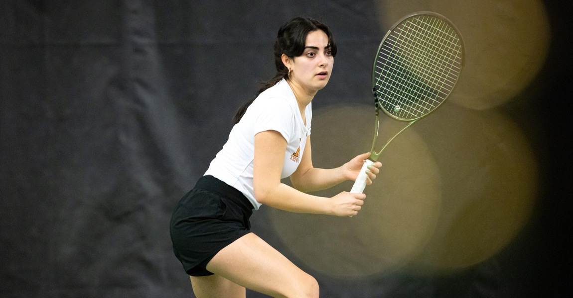 Rebecca Elias playing tennis.
