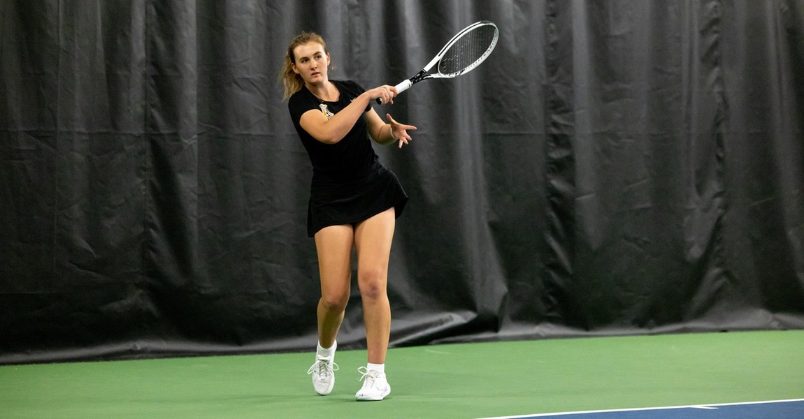 Ivy Walker playing tennis.