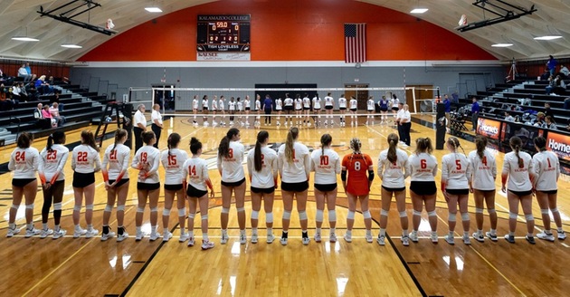 The Kalamazoo College volleyball team getting ready for the starting lineups.